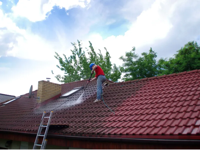 Professional high-pressure roof cleaning in progress on Australian tiled roof
